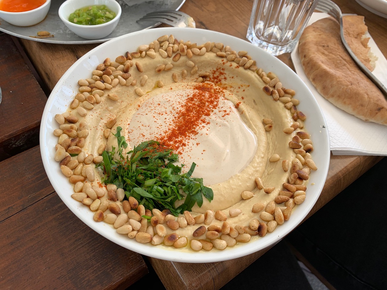 fresh veggie sticks with a bowl of creamy hummus.